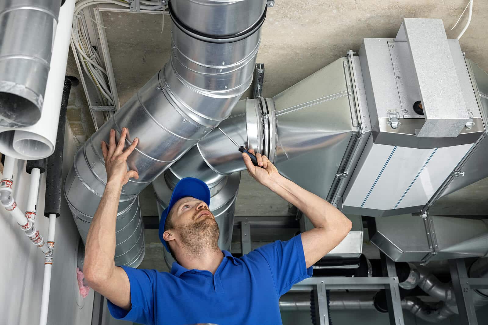 HVAC technician inspecting and repairing air ducts in Yuba City